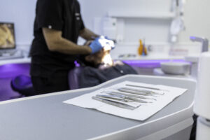 Dentist cleaning a tooth during root canal treatment